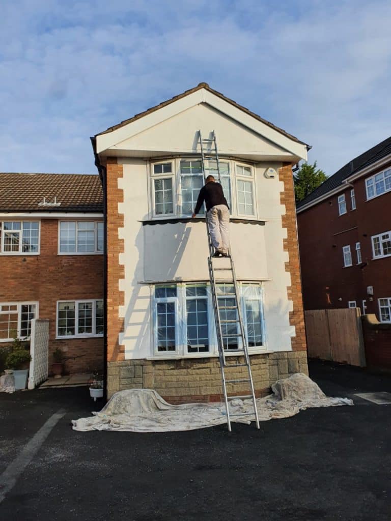 exterior painting and decorating being carried out in winter