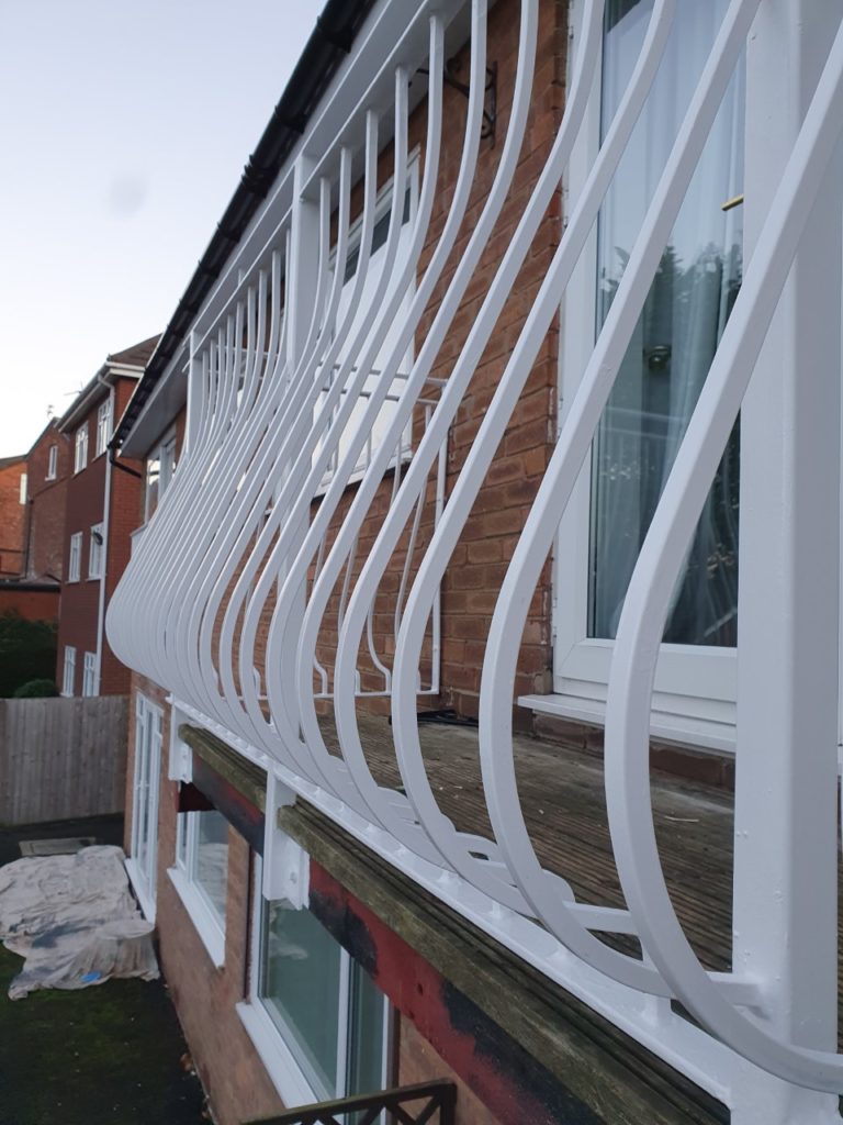 finished metal railings after being painted with hammerite