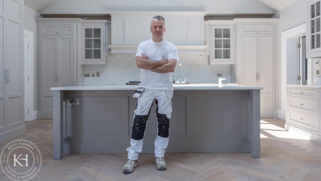 Kevin Haughey in a kitchen he has just painted