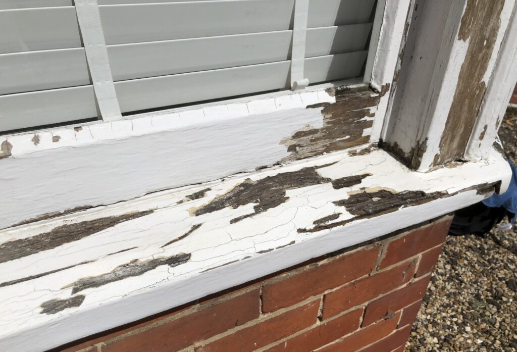 Exterior rotted wood and flaking paint