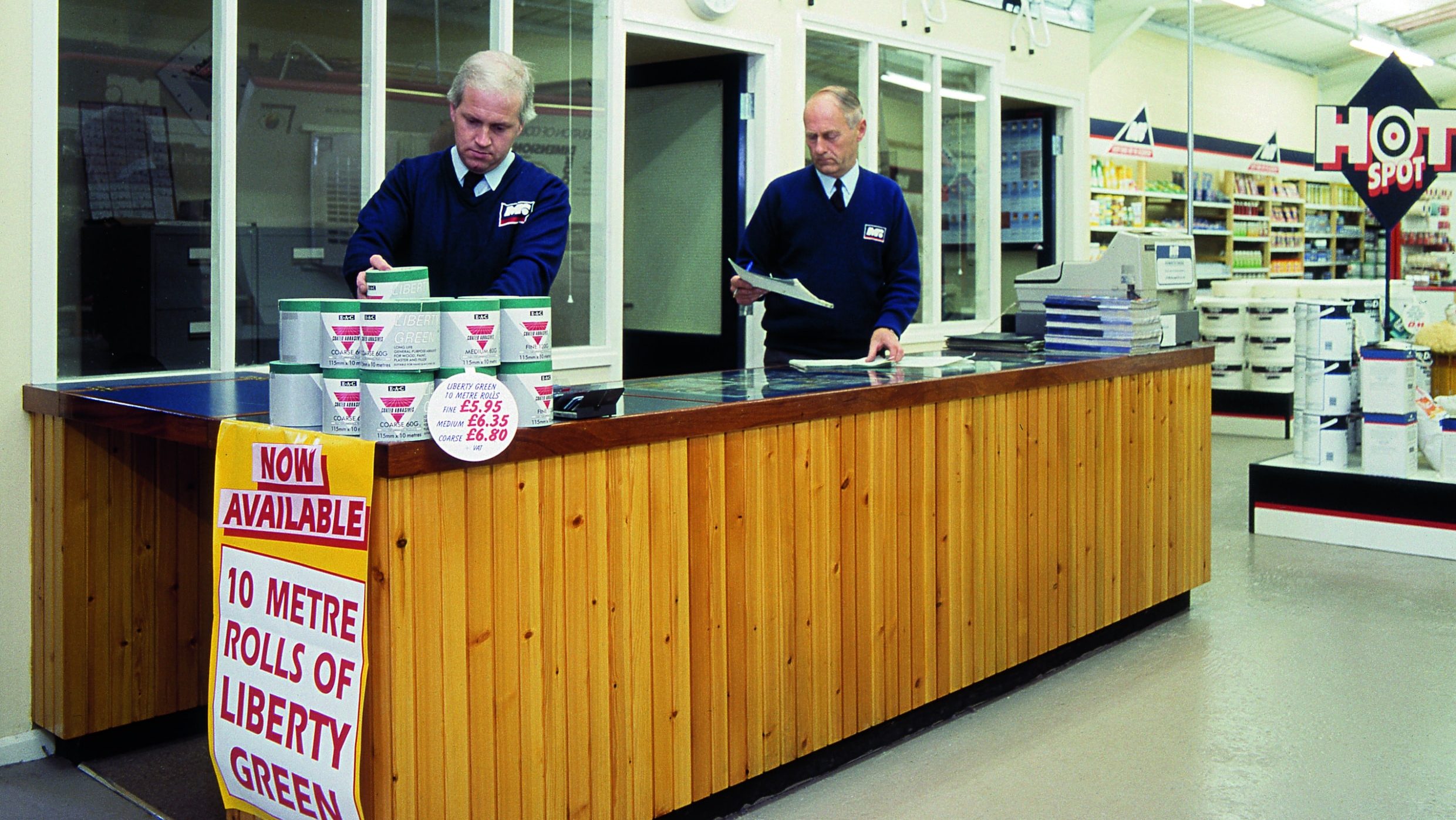 Two men at an old Dulux Decorator Centre