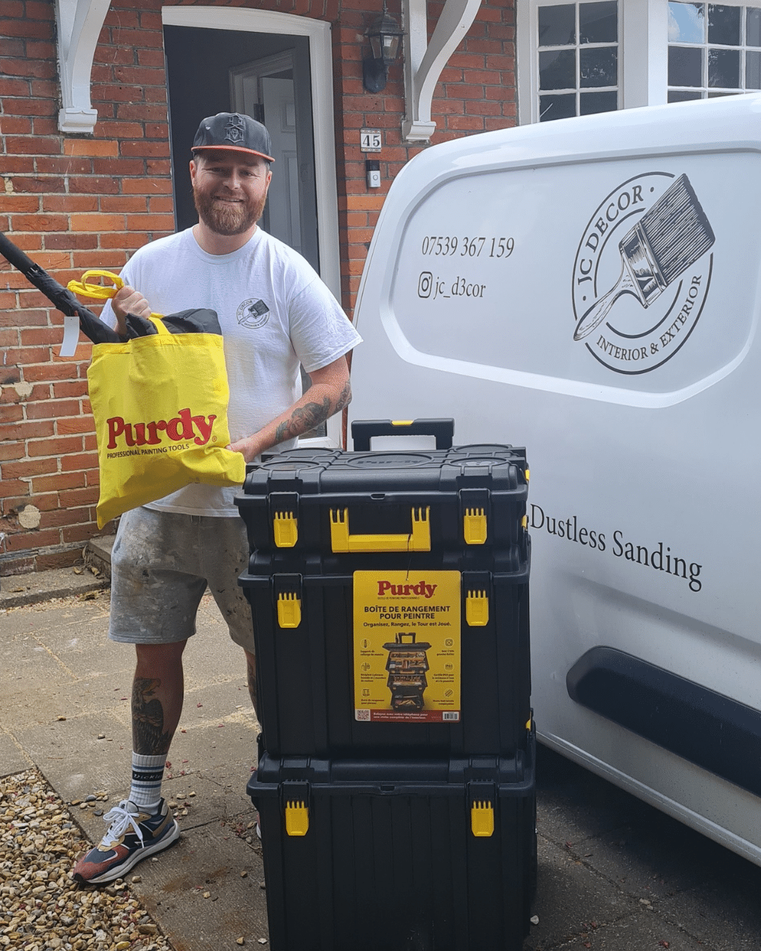 Joe stood with Purdy tools he had just won