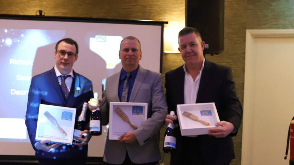 Three Dulux select decorators receiving an award.