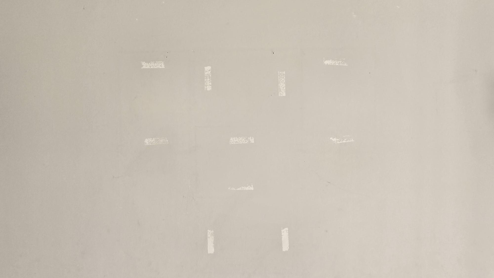 0015d3d0-5dad-47c3-aad3-3fcac4203d87 Sticker residue on a wall
